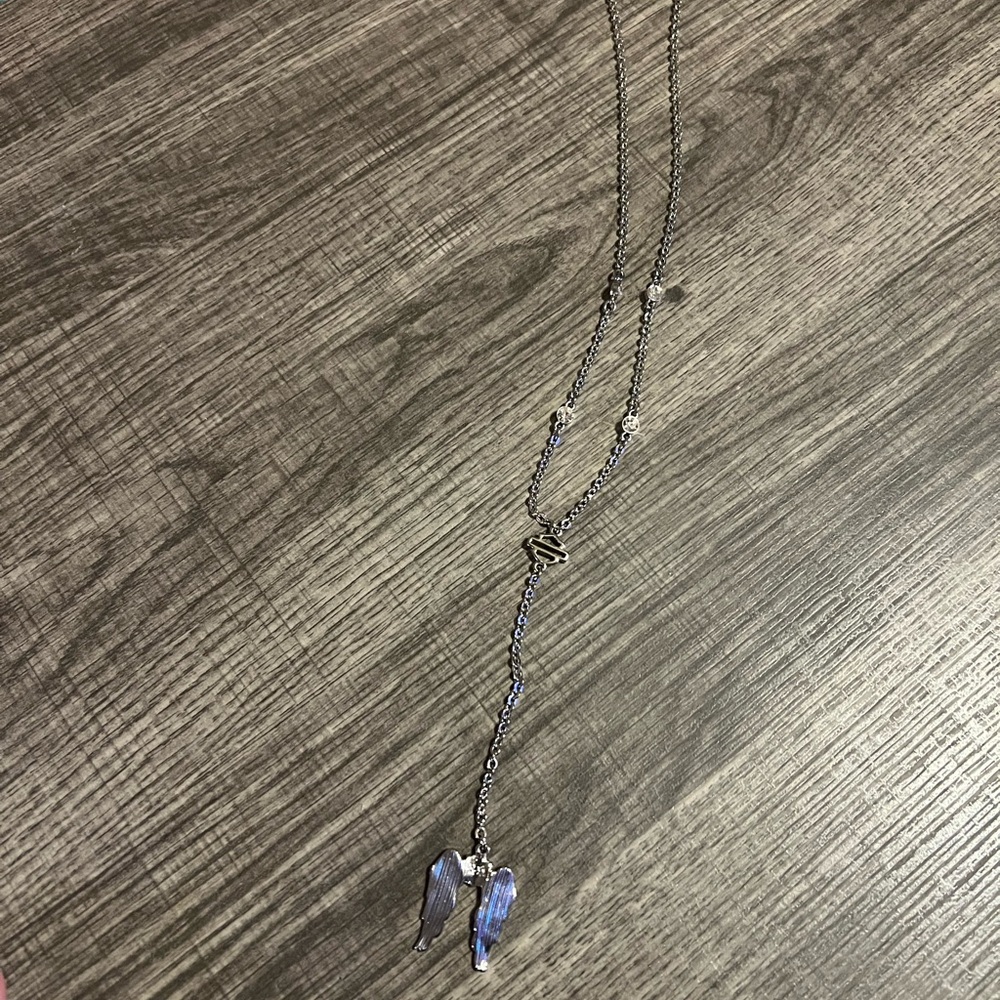 Harley Davidson necklace with emblem, and an extended chain with angel wings!